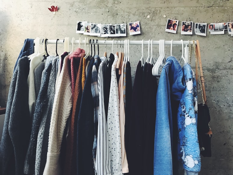 Second hand clothes displayed on a hanger