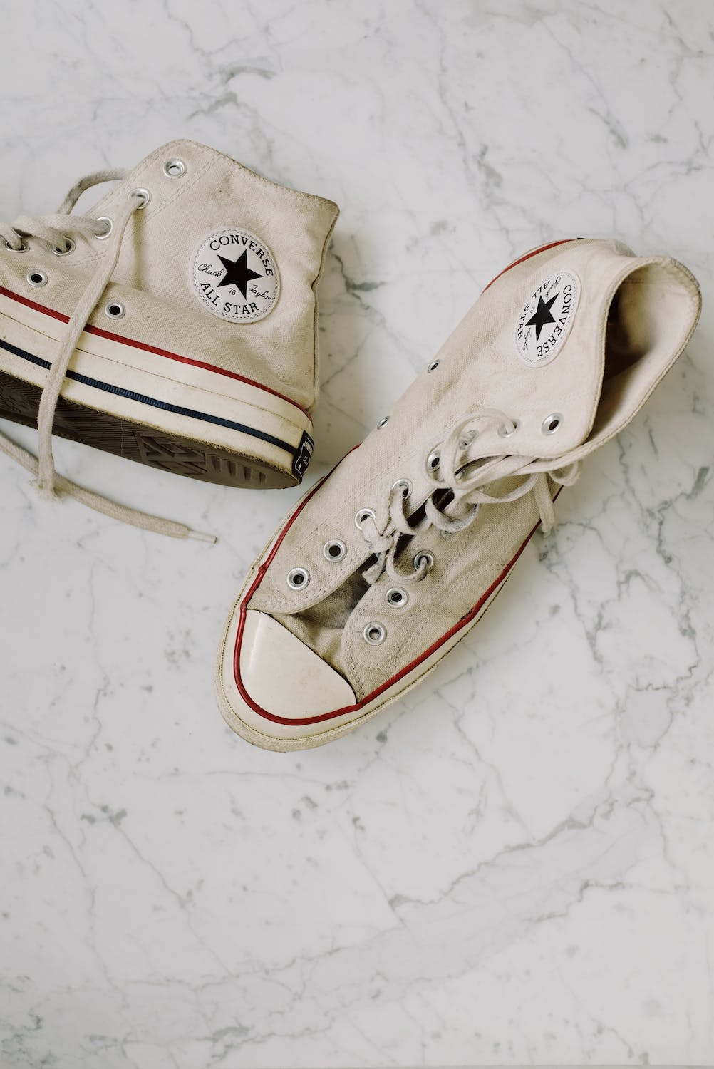 Used white converse sneakers