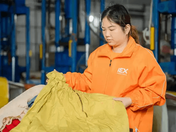 Indetexx worker is examining the clothes