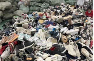 pile of used shoes for sorting