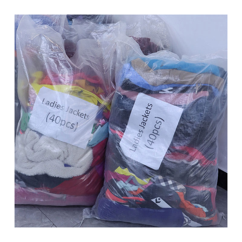 bales of Used brand clothing with labels and number of pieces