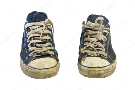 pair of unwashed used sneakers