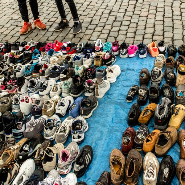outdoor stall with a display of second hand shoes in Africa