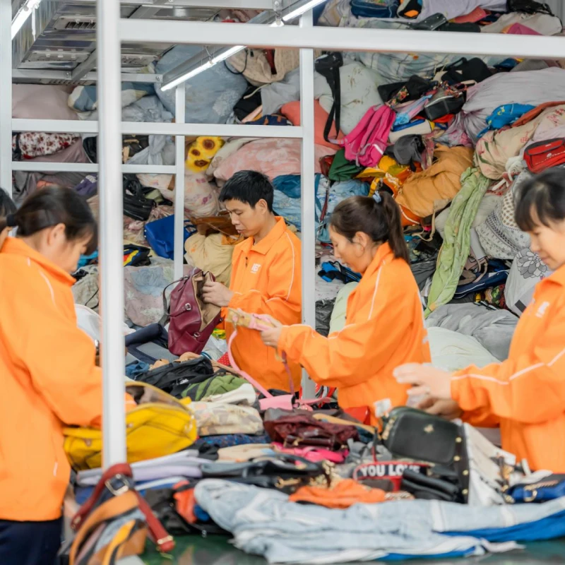 Indetexx‘s workers are inspecting second hand leather bags