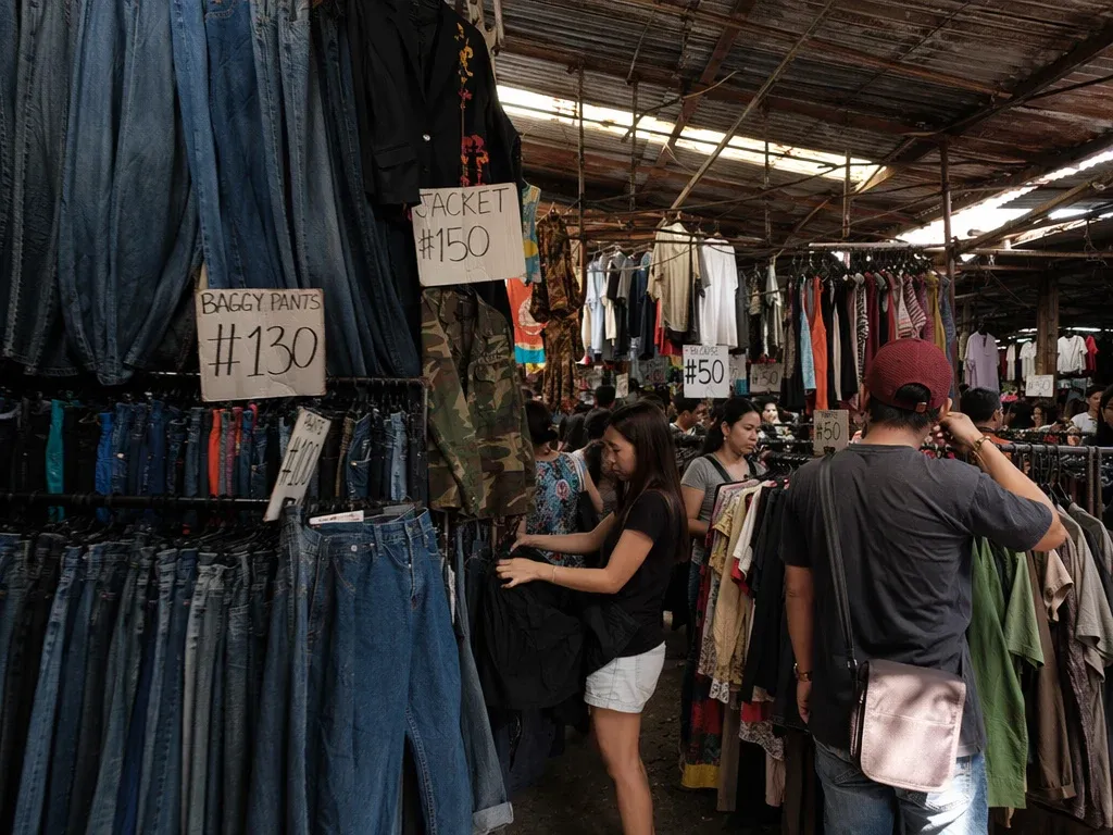 Ukay-ukay market stall in Manila Philippines — secondhand clothing retail scene